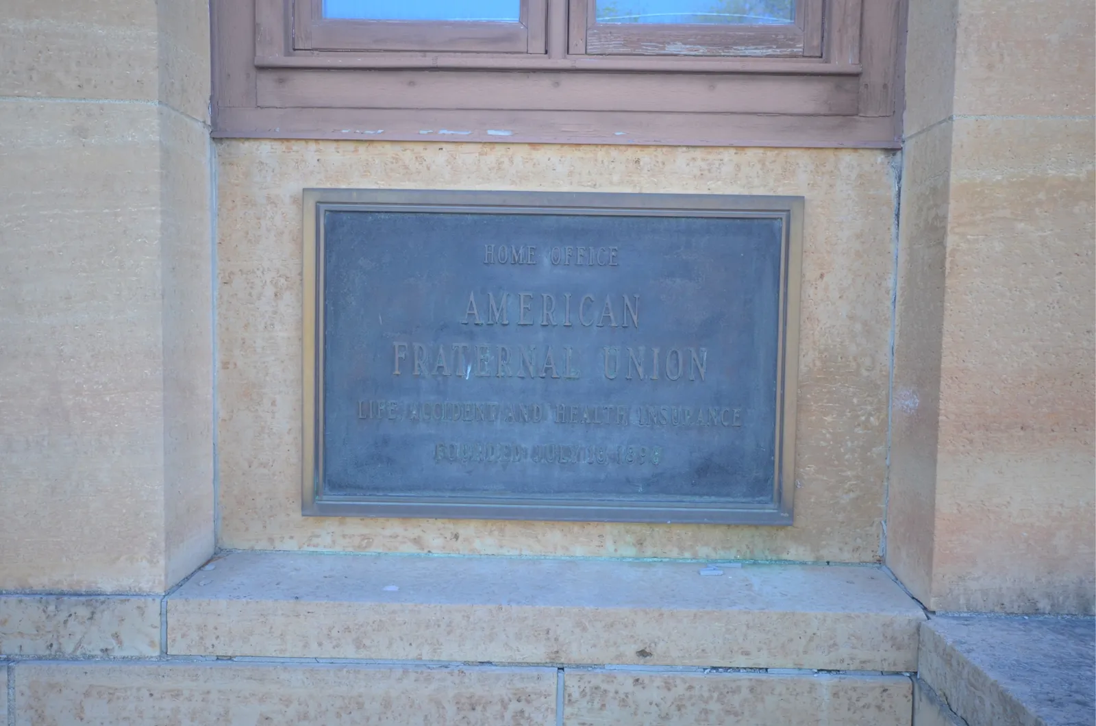 Bronze plaque reading Home Office, American Fraternal Union, Life, Accident and Health Insurance, Founded July 18, 1898
