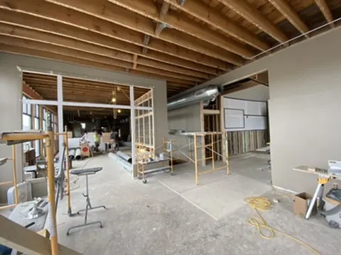 The interior opened up with exposed ceiling joists and new partitions