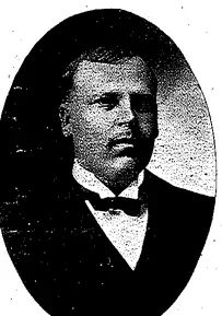 Oval portrait of Dr. Anterro Ferdinand Tanner in a dark suit and bow tie